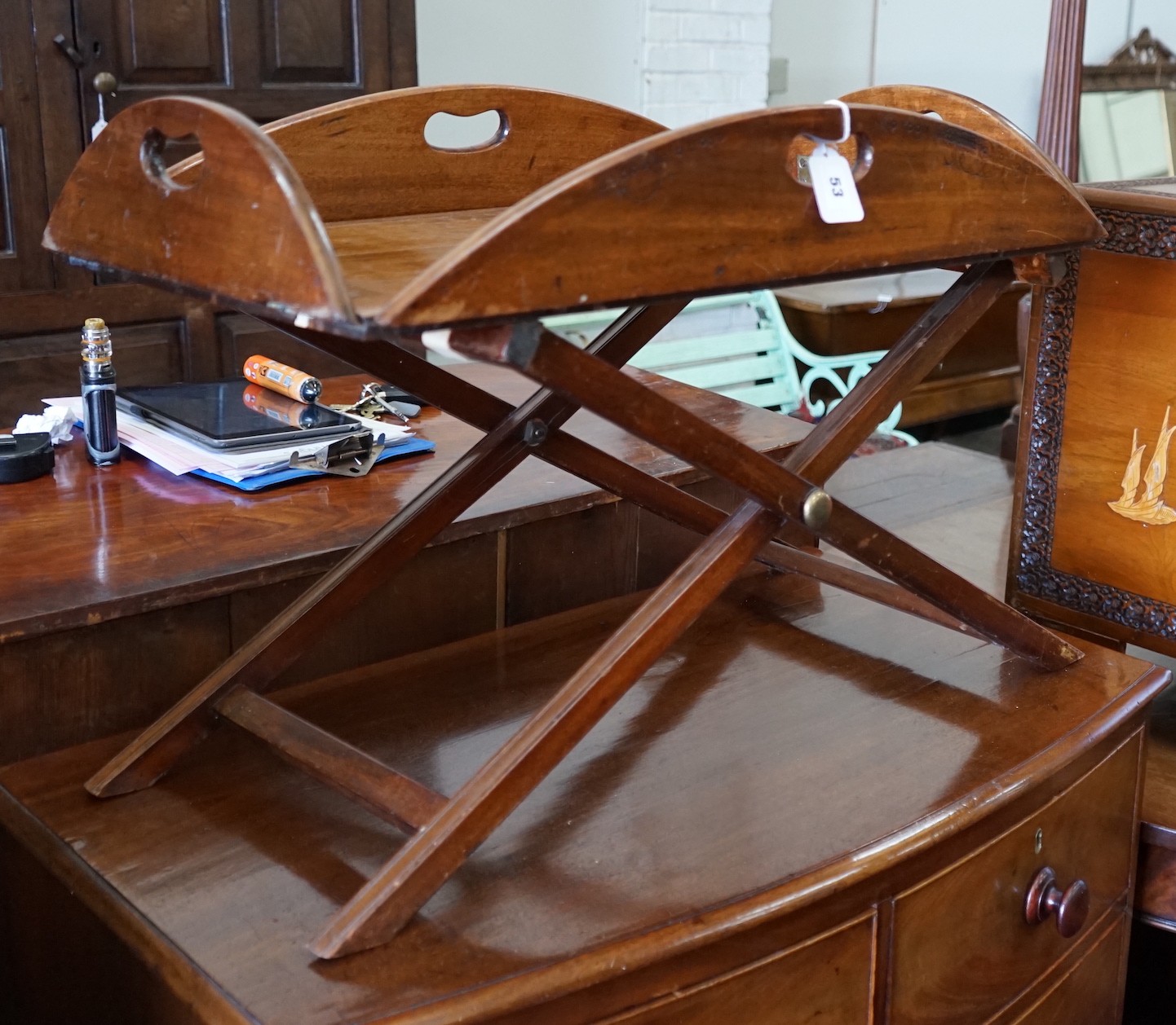 A Victorian mahogany folding butler’s tray, width 91cm, depth 63cm, height 41cm on later stand